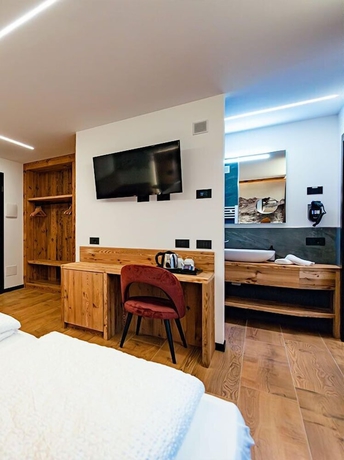 Imagen de la habitación del Dolomites Resort Formi&egrave;. Foto 11