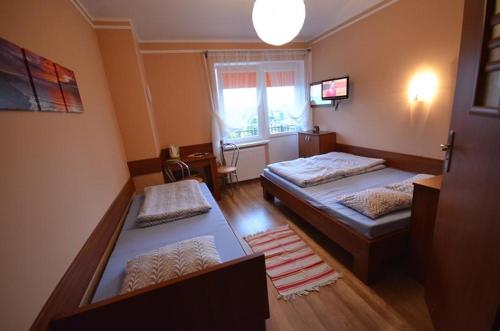 Imagen de la habitación del Domki i Pokoje Zielony Zakątek - Mini Zoo - Duży Plac Zabaw - Komfort i Cisza. Foto 18