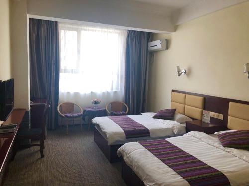 Imagen de la habitación del Dunhuang Come Back Again Inn. Foto 9