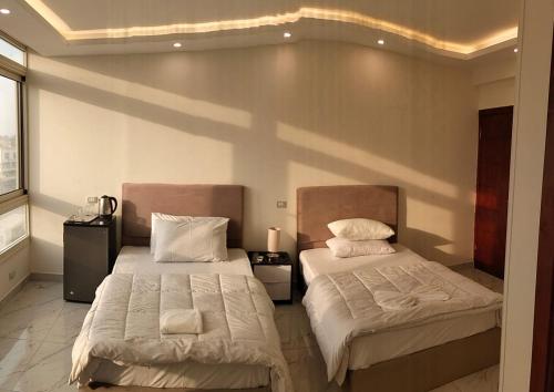Imagen de la habitación del ELEGANT pyramids view motel. Foto 18