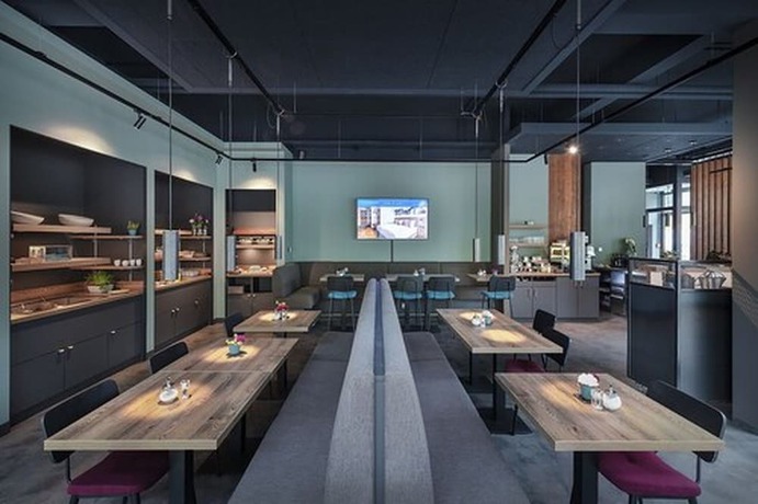 Imagen del bar/restaurante del Ecome Hotel. Foto 7