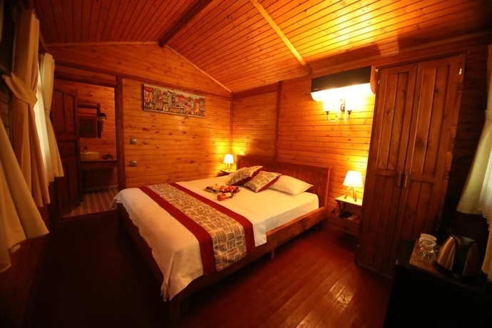 Imagen de la habitación del Eden Bungalows and Beach. Foto 18