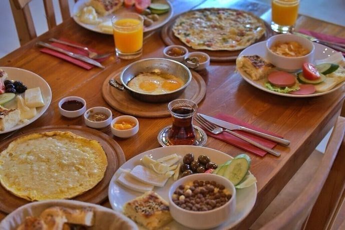 Imagen del bar/restaurante del Eden Bungalows and Beach. Foto 6