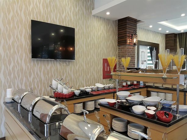 Imagen del bar/restaurante del Elgarden Hotel And Residence. Foto 6