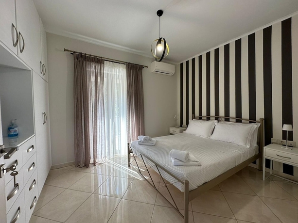 Imagen de la habitación del Elpida Luxury Apartments and Suites. Foto 7