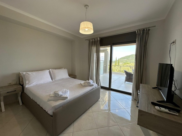 Imagen de la habitación del Elpida Luxury Apartments and Suites. Foto 19