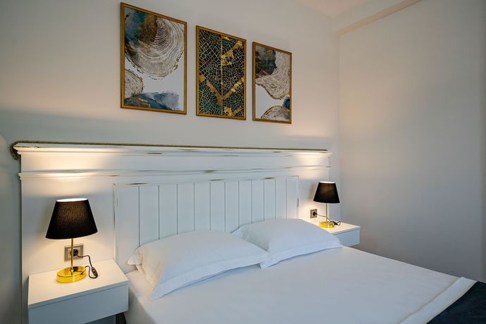 Imagen de la habitación del Eluxio Suite Hotel. Foto 12