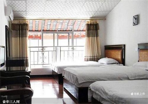 Imagen general del Emeishan Sanyuan Shuzhuang Home Stay. Foto 5