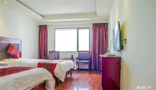 Imagen general del Emeishan Sanyuan Shuzhuang Home Stay. Foto 9