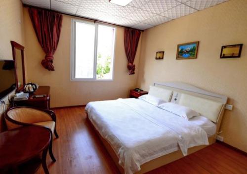 Imagen de la habitación del Emeishan Yage Hotel. Foto 8