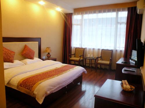 Imagen de la habitación del Emeishan Ziqiang Inn. Foto 9