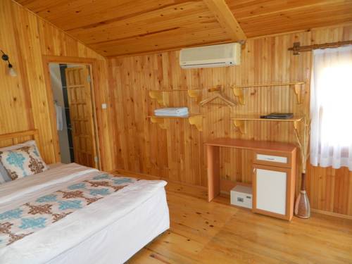 Imagen de la habitación del Etenna Beach Bungalows, &Ccedil;irali. Foto 3