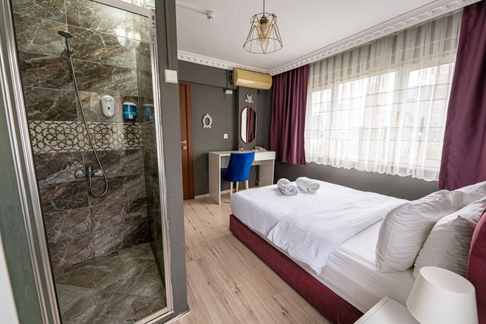 Imagen de la habitación del Evin Suit Hotel. Foto 11
