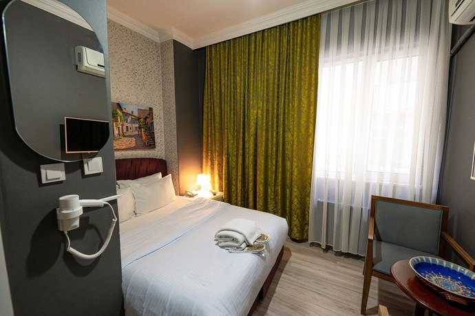 Imagen de la habitación del Evin Suit Hotel. Foto 13