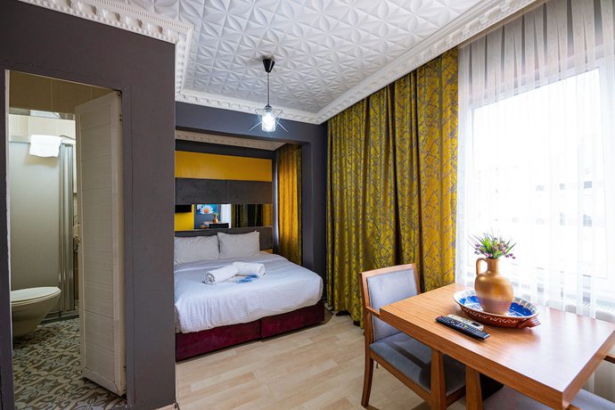 Imagen de la habitación del Evin Suit Hotel. Foto 18