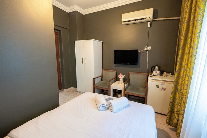 Imagen de la habitación del Evin Suit Hotel. Foto 19