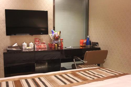 Imagen de la habitación del Feifan Chengpin Hotel Shanmutang. Foto 7