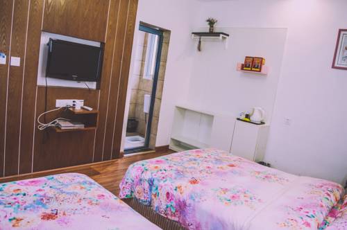 Imagen de la habitación del Fenghuang Ancient City Jiaxing Inn. Foto 5