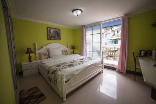 Imagen de la habitación del Fenghuang Jianghu Inn. Foto 2