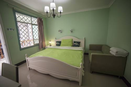 Imagen de la habitación del Fenghuang Jianghu Inn. Foto 3