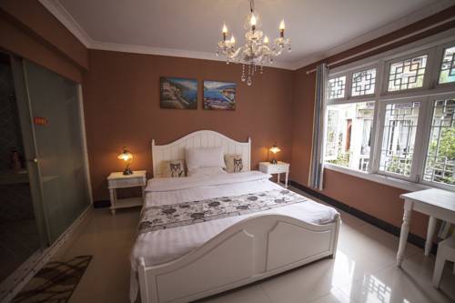 Imagen de la habitación del Fenghuang Jianghu Inn. Foto 6