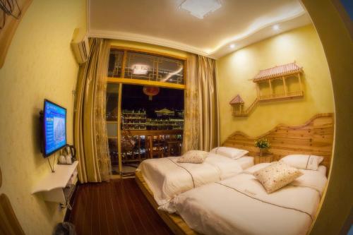 Imagen de la habitación del Fenghuang Jinshui'an Inn. Foto 7