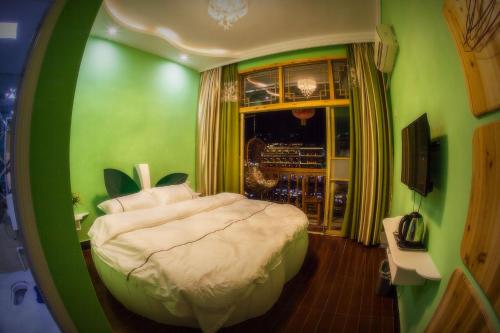 Imagen de la habitación del Fenghuang Jinshui'an Inn. Foto 8