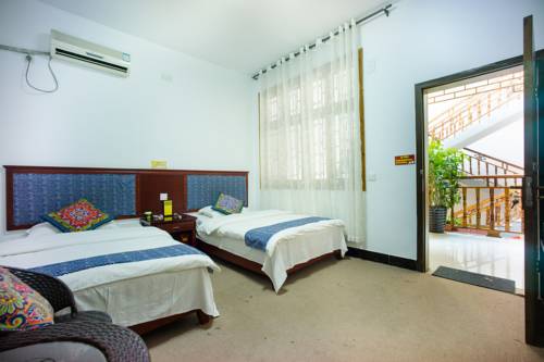 Imagen de la habitación del Fenghuang West Inn. Foto 2