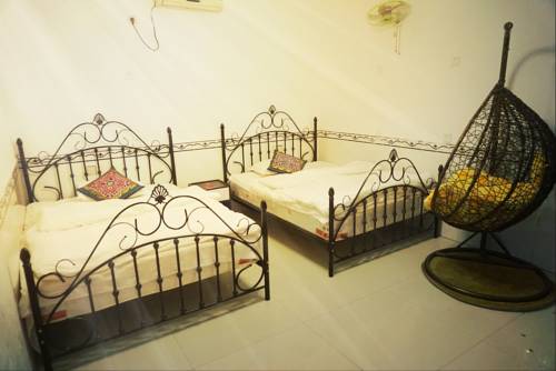 Imagen de la habitación del Fenghuang West Inn. Foto 3