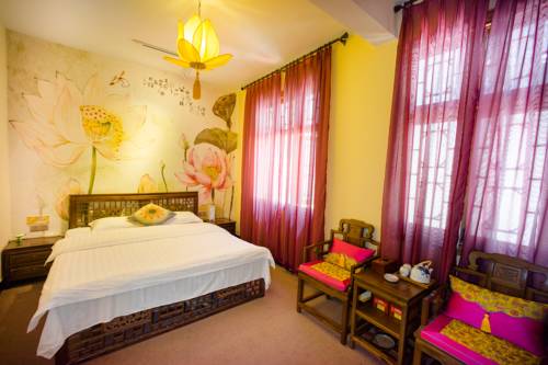 Imagen de la habitación del Fenghuang West Inn. Foto 4