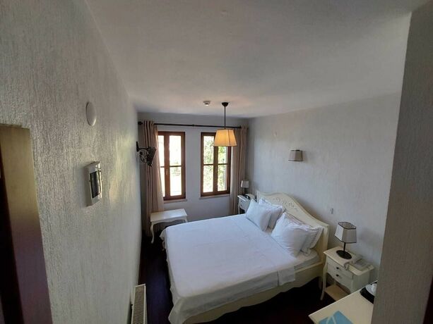 Imagen de la habitación del Ferahi Evler Otel. Foto 19