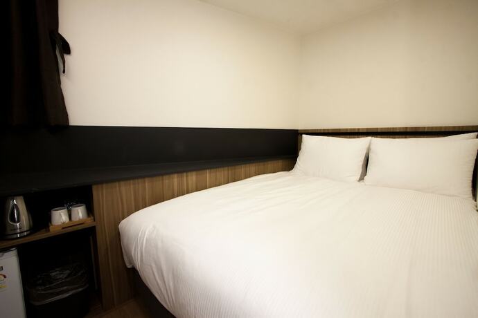 Imagen de la habitación del First Stay Hotel Tawny Owl. Foto 8