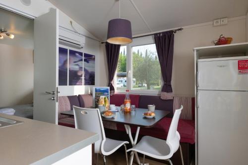 Imagen de la habitación del Fornella Camping & Wellness family resort. Foto 5