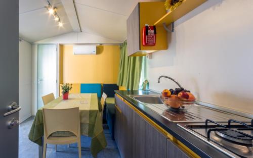 Imagen de la habitación del Fornella Camping & Wellness family resort. Foto 7