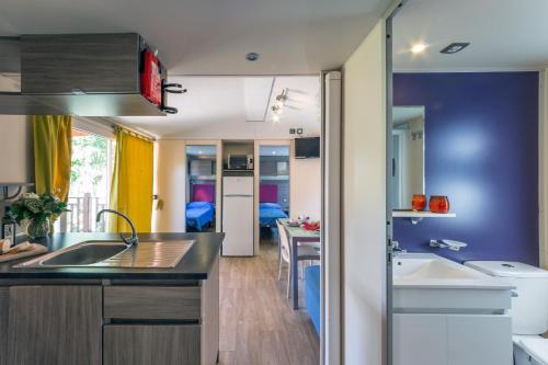 Imagen de la habitación del Fornella Camping & Wellness family resort. Foto 8