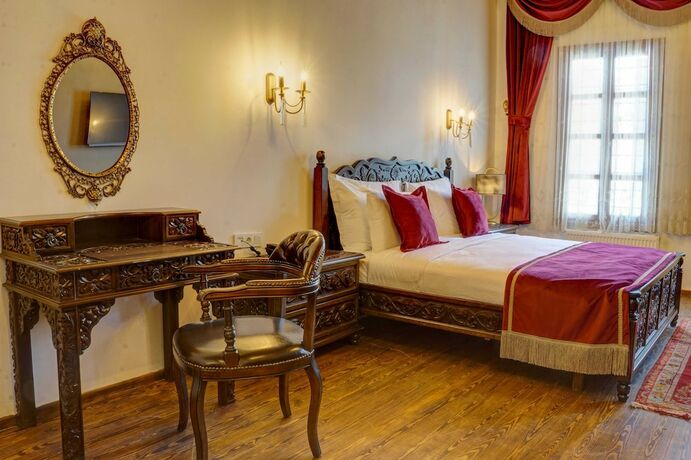 Imagen de la habitación del Four Mansions Hotel. Foto 13