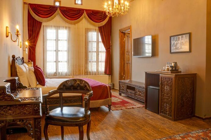 Imagen de la habitación del Four Mansions Hotel. Foto 17