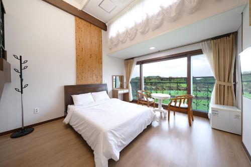 Imagen de la habitación del FromH T Resort Jeju Seongsan. Foto 20