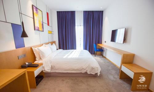 Imagen de la habitación del Fuyinqingshe Hotel. Foto 7