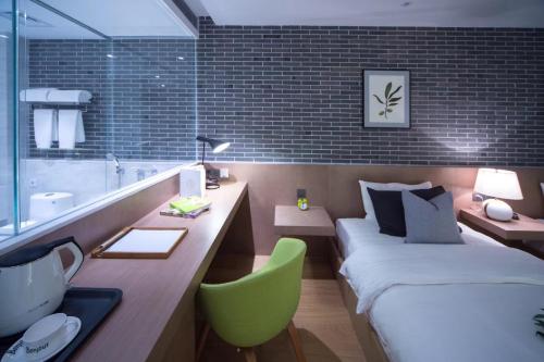 Imagen de la habitación del Fuyinqingshe Hotel. Foto 8