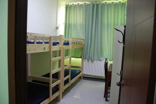 Imagen de la habitación del Gardenia Blossom Youth Hotel. Foto 9