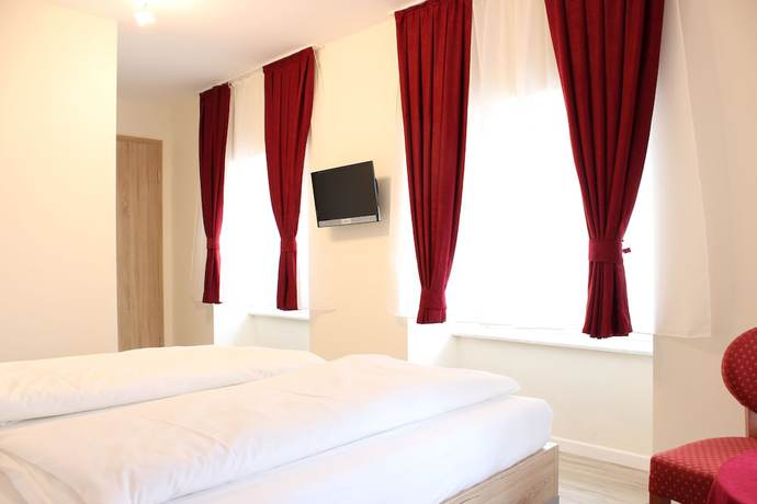Imagen de la habitación del Garni City Hotel. Foto 11
