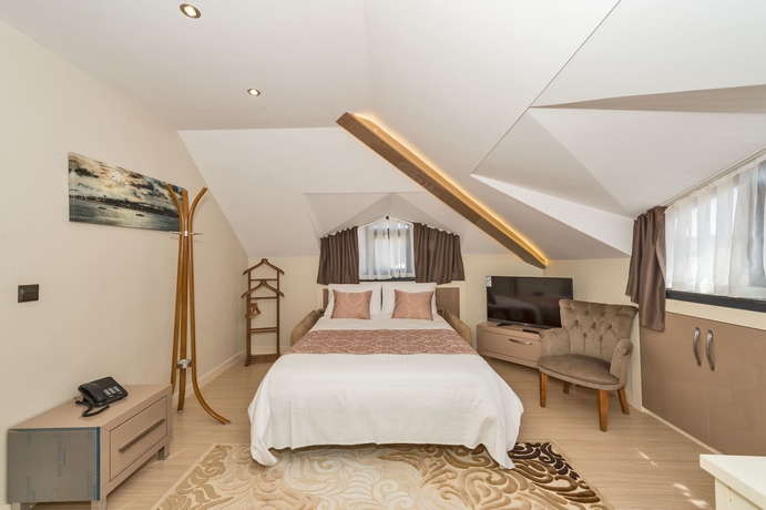 Imagen de la habitación del Gen Suites. Foto 13