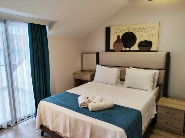 Imagen de la habitación del Gloria Suite Hotel. Foto 19
