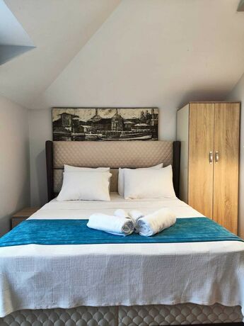 Imagen de la habitación del Gloria Suite Hotel. Foto 20
