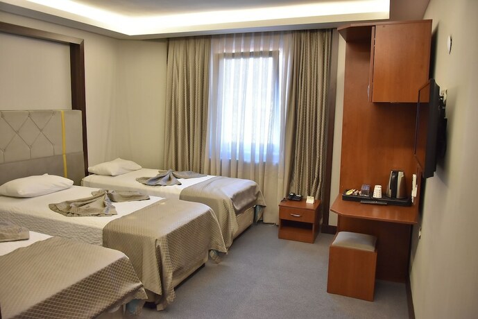 Imagen de la habitación del Gold City Hotel. Foto 17