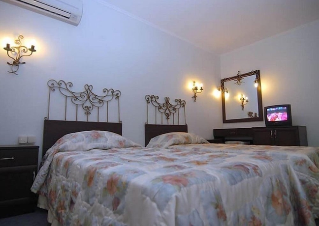 Imagen de la habitación del Grand Asa Family Suites. Foto 6