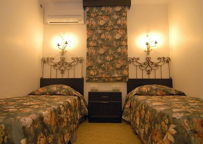 Imagen de la habitación del Grand Asa Family Suites. Foto 10