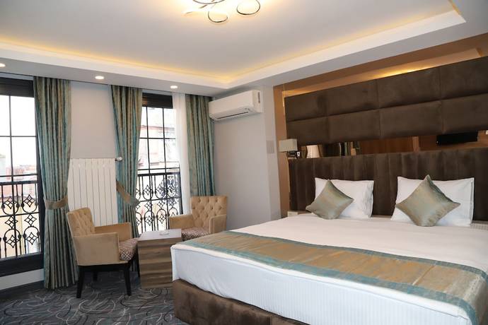 Imagen de la habitación del Grand Kavi Hotel. Foto 11