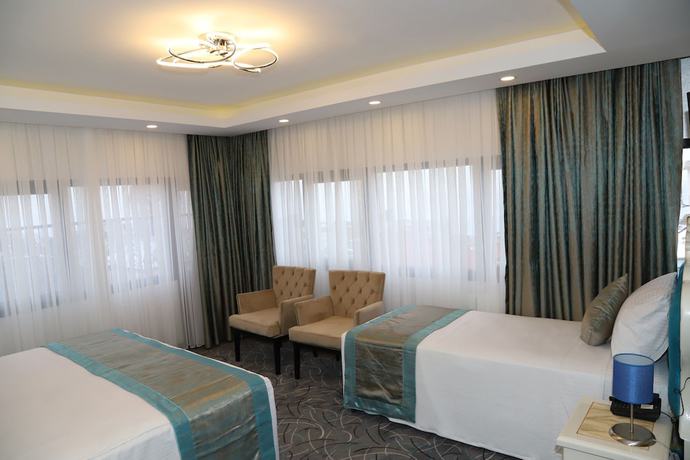 Imagen de la habitación del Grand Kavi Hotel. Foto 17